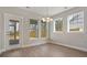 Bright dining room with hardwood floors and large windows overlooking the backyard at 316 Trailmore Ln, Summerville, SC 29486