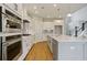 Spacious kitchen with stainless steel appliances and a large island with seating at 316 Trailmore Ln, Summerville, SC 29486