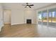 Spacious living room with corner fireplace and sliding glass doors to backyard at 316 Trailmore Ln, Summerville, SC 29486