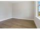 Empty study with hardwood floors and large windows providing natural light at 316 Trailmore Ln, Summerville, SC 29486