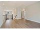 Upstairs hallway with wood-look flooring and view to lower level at 316 Trailmore Ln, Summerville, SC 29486