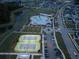 Aerial view of community amenities at dusk at 323 Trailmore Ln, Summerville, SC 29486