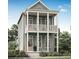 Two-story craftsman style home with a light green exterior, front porch, and balcony at 323 Trailmore Ln, Summerville, SC 29486