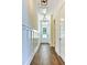 Bright hallway with wood floors and wainscoting at 346 Trailmore Ln, Summerville, SC 29486