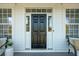 Black front door with sidelights on a white house at 3562 Stockton Dr, Mount Pleasant, SC 29466