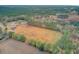 Aerial view of property showing home, large lot, and surrounding land at 388 E Main St, Harleyville, SC 29448