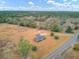 Aerial view showcasing home, expansive lot, and surrounding landscape at 388 E Main St, Harleyville, SC 29448