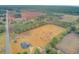Aerial view of property showing home, large lot, and surrounding land at 388 E Main St, Harleyville, SC 29448
