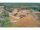 Aerial view showing home's location, large lot, and surrounding landscape at 388 E Main St, Harleyville, SC 29448