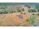 Aerial view highlighting home's location, lot size, and surrounding landscape at 388 E Main St, Harleyville, SC 29448