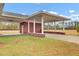 Covered carport with brick columns and open sides at 388 E Main St, Harleyville, SC 29448
