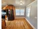 Light-filled dining area with hardwood floors and neutral walls at 388 E Main St, Harleyville, SC 29448