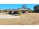 Brick home with covered carport at 388 E Main St, Harleyville, SC 29448
