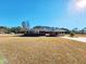 Brick home with covered porch at 388 E Main St, Harleyville, SC 29448