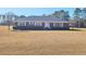 Brick ranch house with large yard at 388 E Main St, Harleyville, SC 29448