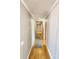Long hallway with hardwood floors and gray striped wallpaper at 388 E Main St, Harleyville, SC 29448