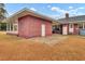 Brick home with covered patio and expansive yard at 388 E Main St, Harleyville, SC 29448