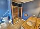 Walk-in shower with a built-in seat and neutral tile at 388 E Main St, Harleyville, SC 29448