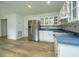 Small basement kitchen with white cabinets and stainless steel appliances at 738 Olney Rd, Charleston, SC 29414