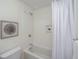 Clean bathroom with a shower/tub combo and white tile at 738 Olney Rd, Charleston, SC 29414