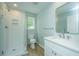 Modern bathroom with white subway tile shower and white vanity at 738 Olney Rd, Charleston, SC 29414