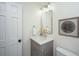 Elegant powder room with grey vanity and a modern mirror at 738 Olney Rd, Charleston, SC 29414