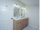 Updated bathroom with double vanity, quartz countertop, and tiled shower at 738 Olney Rd, Charleston, SC 29414