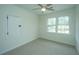 Spacious bedroom with neutral carpeting and two large windows at 738 Olney Rd, Charleston, SC 29414