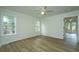 Bedroom with hardwood floors, two windows, and access to deck at 738 Olney Rd, Charleston, SC 29414