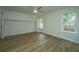 Spacious bedroom featuring hardwood floors and two large windows at 738 Olney Rd, Charleston, SC 29414