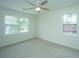 Bright bedroom with two large windows and ceiling fan at 738 Olney Rd, Charleston, SC 29414