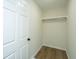 Walk-in closet with wood flooring and a hanging rod at 738 Olney Rd, Charleston, SC 29414
