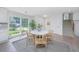 Charming dining area features a round table and four chairs near a kitchen and staircase at 738 Olney Rd, Charleston, SC 29414