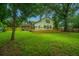 Back of house with deck and large backyard at 738 Olney Rd, Charleston, SC 29414