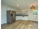Eat-in kitchen with stainless steel appliances and white cabinets at 738 Olney Rd, Charleston, SC 29414