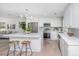 Renovated kitchen, featuring island, stainless steel appliances, and white shaker cabinets at 738 Olney Rd, Charleston, SC 29414
