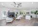 Bright living room with fireplace and hardwood floors, featuring comfortable seating at 738 Olney Rd, Charleston, SC 29414