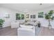 Relaxing living room with comfortable seating and large windows at 738 Olney Rd, Charleston, SC 29414