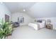 Spacious main bedroom with vaulted ceiling, ceiling fan, and large window at 738 Olney Rd, Charleston, SC 29414