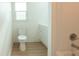 Clean bathroom with white vanity, toilet, and bathtub at 106 Reardon Ave, Walterboro, SC 29488