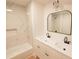 Updated bathroom features a double vanity, marble shower, and a modern soaking tub at 106 Reardon Ave, Walterboro, SC 29488