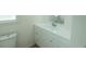 Bathroom with white vanity, toilet and a window for natural light at 106 Reardon Ave, Walterboro, SC 29488