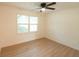 Bright bedroom with wood floors, double window, and ceiling fan at 106 Reardon Ave, Walterboro, SC 29488