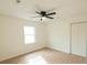 Bright bedroom with ceiling fan, window, and light flooring at 106 Reardon Ave, Walterboro, SC 29488