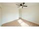 Bright bedroom with ceiling fan, window, and light flooring at 106 Reardon Ave, Walterboro, SC 29488