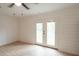 Spacious bonus room with wood-look floors and French doors leading outside at 106 Reardon Ave, Walterboro, SC 29488