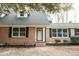 Brick home front entrance with black shutters at 106 Reardon Ave, Walterboro, SC 29488