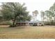 Brick ranch home with large yard and mature trees at 106 Reardon Ave, Walterboro, SC 29488