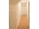 Light and bright hallway with light brown flooring and white walls at 106 Reardon Ave, Walterboro, SC 29488