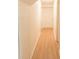 Light and bright hallway with light brown flooring and white walls at 106 Reardon Ave, Walterboro, SC 29488